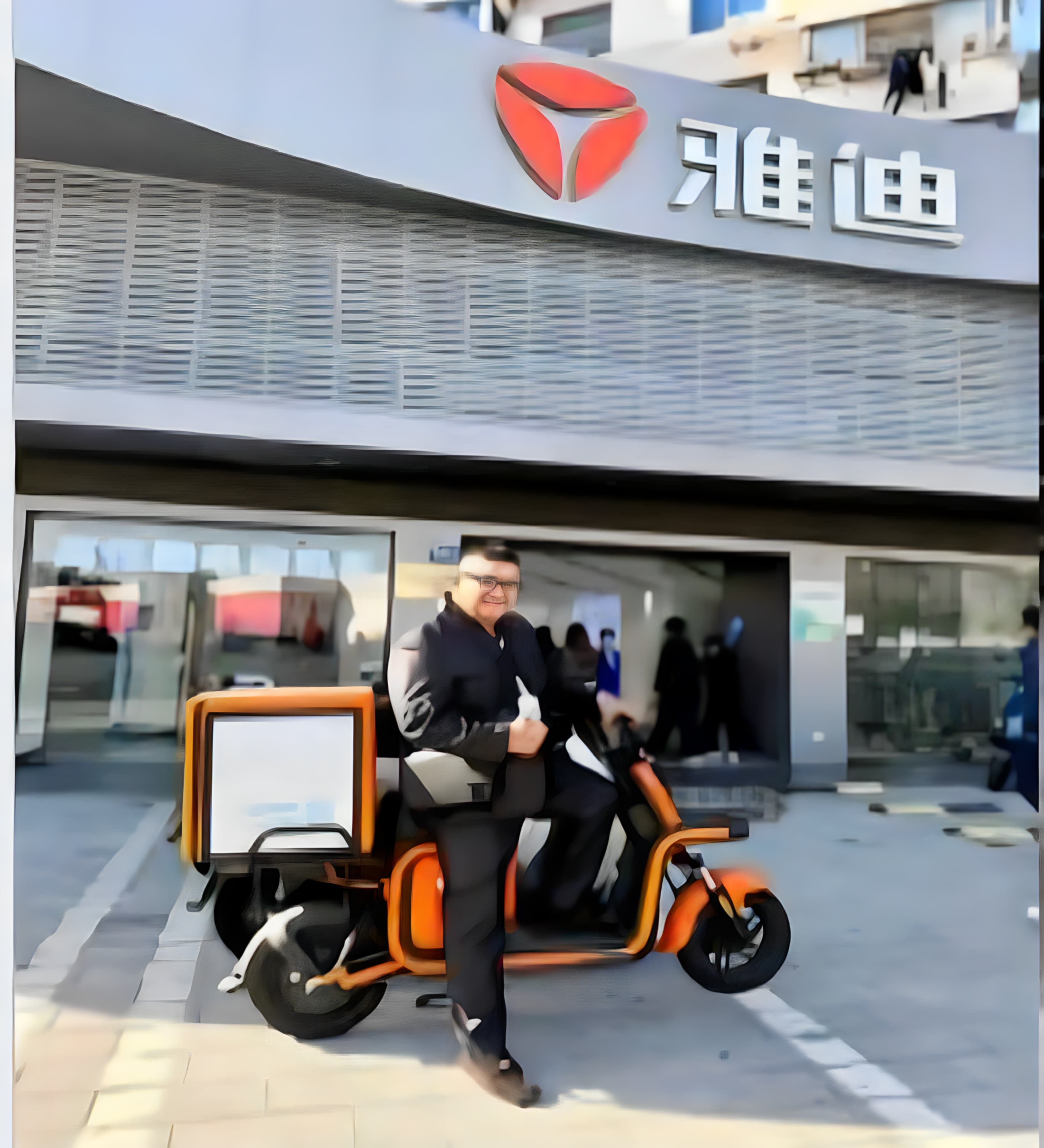 Nagar Lady team member with a Yadea electric scooter