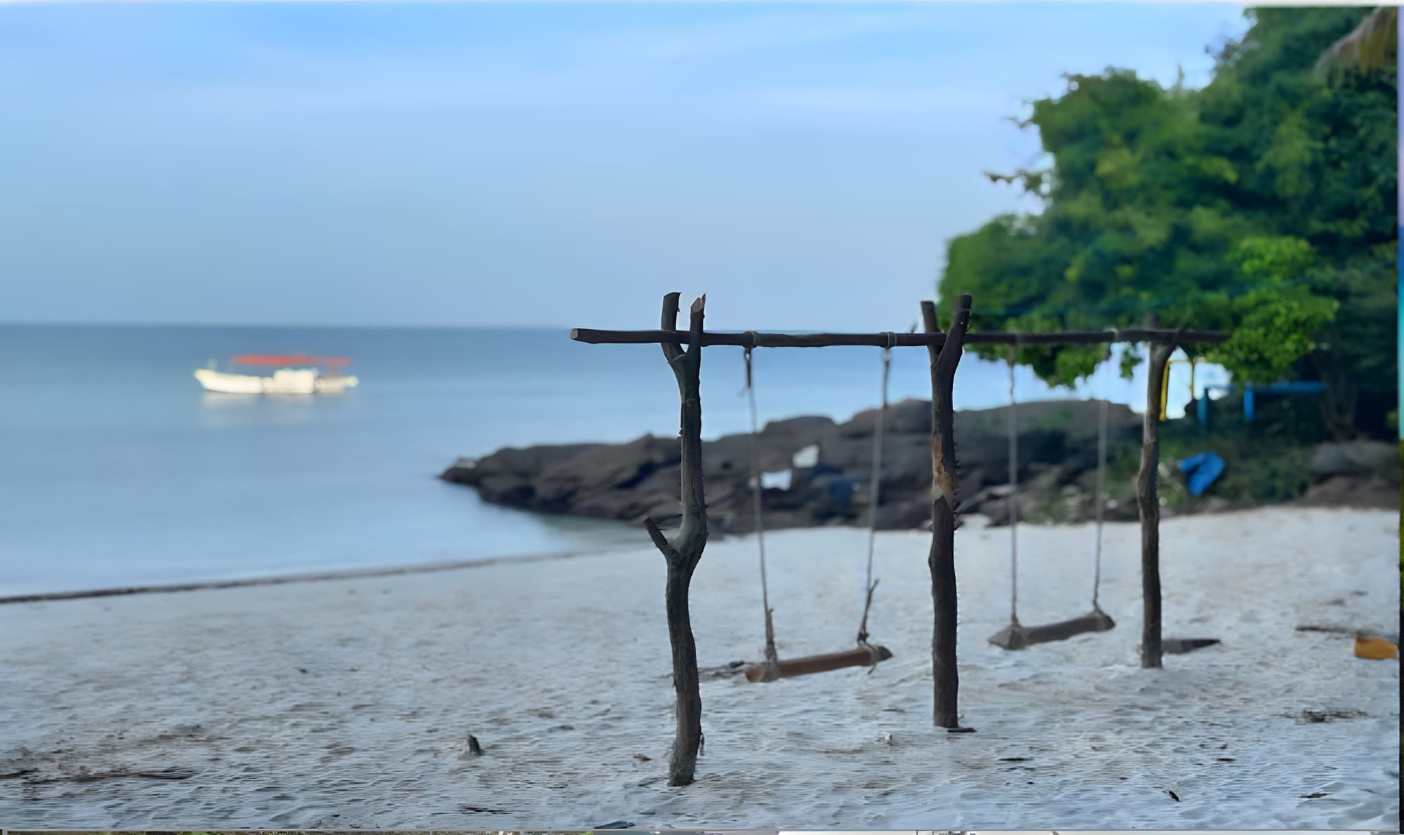 Wooden swings on Thameehla Island's beach