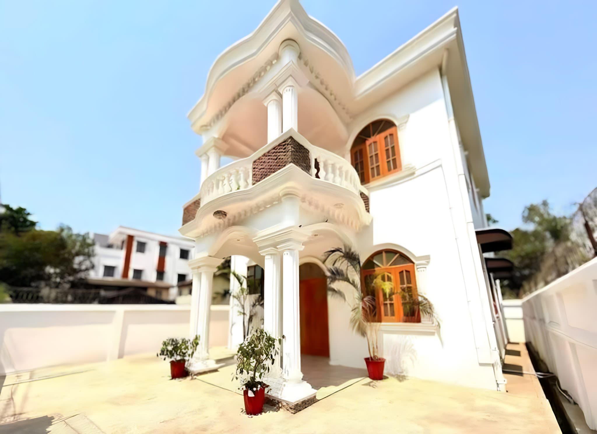 White villa with a domed balcony